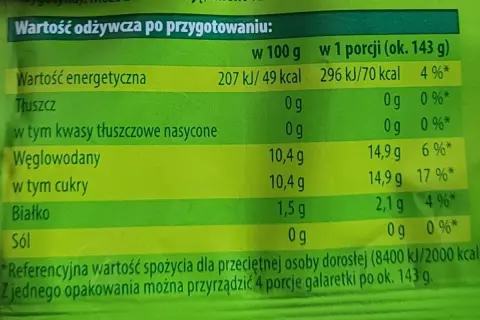 Tabela wartości odżywczych galaretki po przygotowaniu, z podziałem na 100g i porcję.
