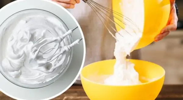 Kremowa masa z mascarpone, ubijana mikserem, przelewana z żółtej miski do drugiej.